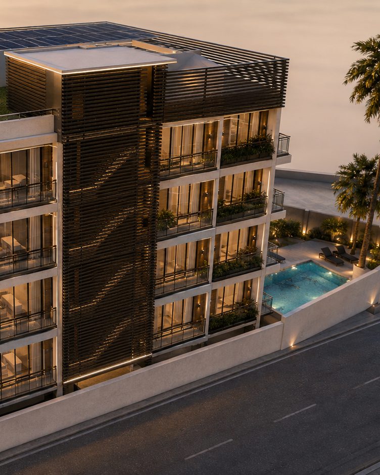 Casabella Tower vista desde el aire al atardecer: la parcela cerrada sobre su calle de Palm Beach, con la terraza de la piscina y las tumbonas junto al edificio, palmeras en el cierre y la instalación solar en la azotea.